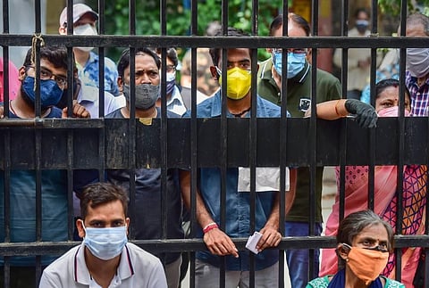 Beneficiaries wait to receive the second dose of the COVID-19 vaccine at a vaccination centre in New Delhi. (Photo | PTI)