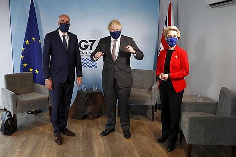 Britain's Prime Minister Boris Johnson, center, meets with European Commission President Ursula von der Leyen and European Council President Charles Michel, left, during the G7 summit. (Photo | AP)