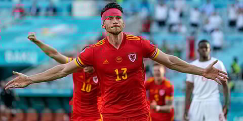Wales' Kieffer Moore celebrates after scoring his side's opening goal during the Euro 2020 soccer championship group A match between Wales and Switzerland, at the Baku Olympic stadium. (Photo| AP