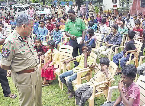 Vijayawada CP Ch Dwaraka Tirumala Rao interacts with children rescued under Operation Muskaan in Vijayawada. (Photo | EPS)