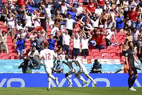 England's Raheem Sterling celebrates after scoring his side's opening goal during the Euro 2020 soccer championship group D match between England and Croatia. (Photo | AP)
