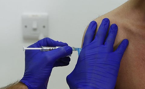 A Phase 3 Novavax coronavirus vaccine trial volunteer is given an injection at St George's University hospital in London. (Photo | AP)