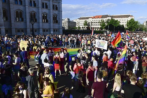 People gather during an LGBT rights demonstration in front of the Hungarian Parliament building in Budapest, Hungary. (Photo | AP)