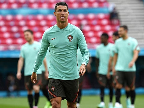 Portugal's Cristiano Ronaldo attends a team training session at the Ferenc Puskas stadium in Budapest, Monday, June 14, 2021. (Photo | AP)