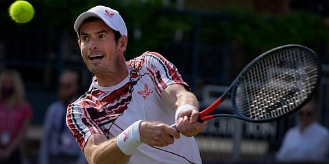Andy Murray plays a return to Benoit Paire during their singles tennis match at the Queens Club tournament in London. (Photo | AP)
