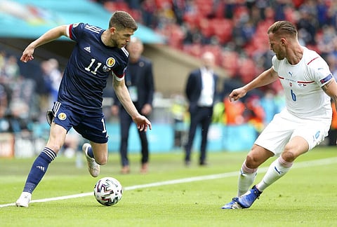 Scotland's Kieran Tierney, left, looks to take the ball past Czech Republic's Tomas Kalas during the Euro 2020 soccer championship group D match. (Photo | AP)