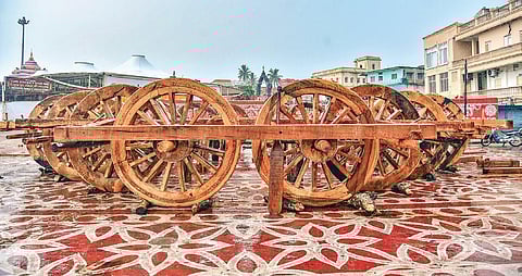 Wheels of the Trinity’s chariots fixed to axles at the construction yard on the Grand Road in Puri I Express