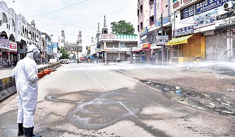 A GHMC worker sprays disinfectant liquid near Charminar (File Photo | Vinay Madapu, EPS)