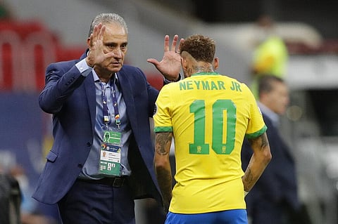 Brazil's Neymar, right, celebrates scoring his side's second goal against Venezuela on a penalty kick with Brazil's coach Tite during a Copa America soccer match. (Photo | AP)