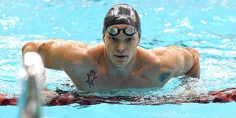 Cody Simpson rests after swimming in the Men's 100-meter Freestyle Heats at the Australian Swimming Trials for the Tokyo Olympic and Paralympic qualification in Adelaide. (Photo | AP)