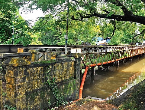 The iron bridge (irumpu paalam) at Tripunithura that was constructed by a London based company in 1890. Though it was decided to preserve the structure by moving it to Hill Palace Museum, the procedur