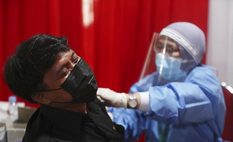 A man receives an injection of the AstraZeneca vaccine during a vaccination campaign in Bekasi outside Jakarta, Indonesia, Thursday, June 17, 2021. (Photo | AP)