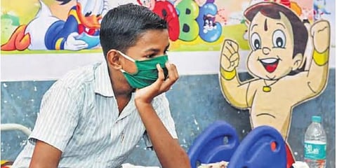 A boy admiited at a COVID-19 care centre in Sangli, Maharashtra. (Photo | PTI)