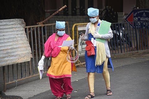 Teachers assigned on Covid duty in Bengaluru. (Photo | Nagaraja Gadekal, EPS)