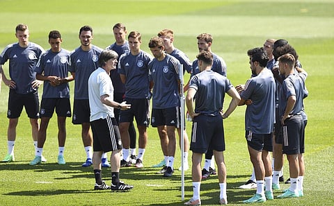 Germany's national coach Joachim Loew, right, talks to players during a training session of the German soccer team at Herzogenaurach, Germany, Friday, June 18, 2021. (Photo | AP)