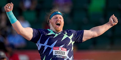 Ryan Crouser celebrates after setting a world record during the finals of men's shot put at the U.S. Olympic Track and Field Trials in Eugene. (Photo | AP)