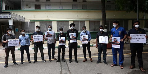 Resident doctors of the All India Institute of Medical Sciences stage a protest against yoga guru Ramdev as part of nationwide agitation. (Photo| Shekhar Yadav, EPS)