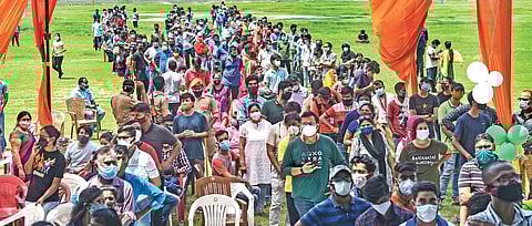 People form long queues during a mega vaccination drive at KD Singh Babu Stadium in Lucknow on Tuesday | PTI