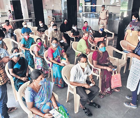 People wait to get vaccine at KBN College in Vijayawada. (File photo | Prasant Madugula)