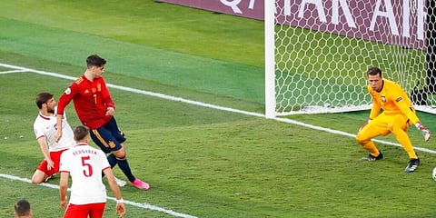 Spain's Alvaro Morata scores his side's goal against Poland. (Photo | AP)