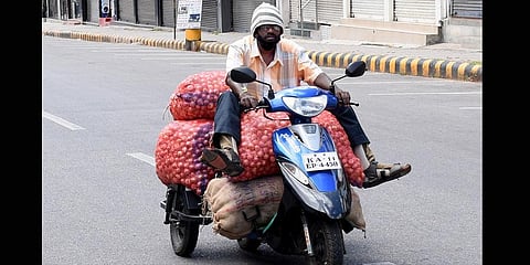 Siddaraju’s only wish is to give his son, now in Class 6 at the Belagola Government School, a good education. (Photo | Udayshankar S, EPS)