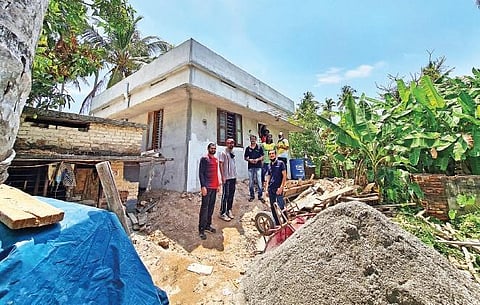 Nibun and team during construction of the new house.