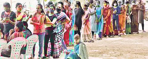 Citizens queue up to get jabs during a special drive at ZPHS school, Raganna Guda village, Hayathnagar mandal on Tuesday. (Photo | Vinay Madapu, EPS)