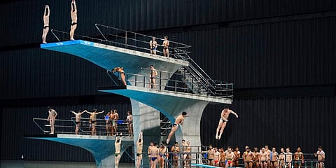 Athletes warm up prior to synchronized 10-meter platform preliminary at the FINA Diving World Cup, served as a qualifying competition for Diving at the Tokyo 2020 Olympic Games. (Photo | AP)