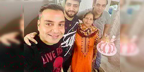 Vinay K Mayer celebrating with family and friends after having gotten his negative result. (Photo| EPS)