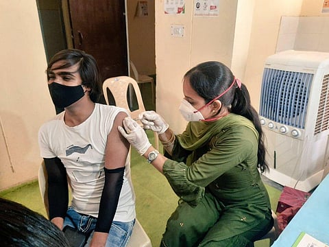 A beneficiary gets the shot at the vaccination camp from transgenders. (Photo | Express)