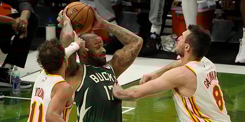 Atlanta Hawks' Onyeka Okongwu is defended by Atlanta Hawks' Trae Young and Danilo Gallinari during the NBA Eastern Conference basketball finals game. (Photo| AP)