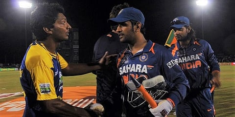 Sri Lanka captian Kumar Sangakkara (L) congratulates Indian skipper MS Dhoni (R) after victory in the final ODI of the Asia Cup at the Rangiri Dambulla International Cricket Stadium. (Photo | AFP)