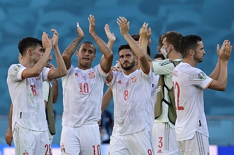 Spain's players celebrate their victory after the UEFA EURO 2020 Group E football match between Slovakia and Spain at La Cartuja Stadium in Seville on June 23, 2021. (Photo | AFP)