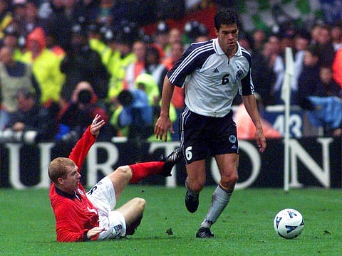 In this Oct. 7, 2000 file photo Germany's Michael Ballack gets past England's Paul Scholes, left, during the group nine World Cup qualification match England versus Germany (Photo | AP)