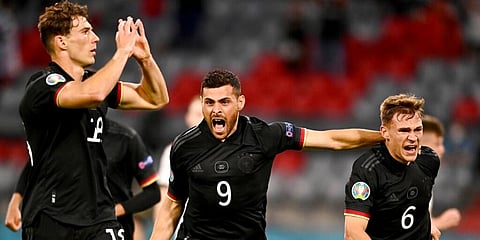 Germany's Leon Goretzka (L) celebrates with teammates after scoring his side's second goal during the Euro 2020 match against Hungary. (Photo | AP)