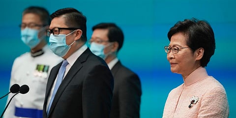 Hong Kong Chief Executive Carrie Lam (R) announces appointment of John Lee (2nd R) as the Chief Secretary. (File photo| AP)