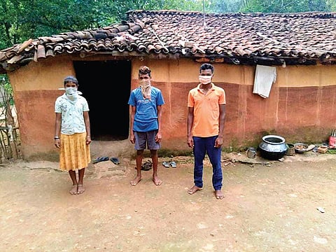 Shyam, Baga and Laxmi in front of their house in Rengali village | Express