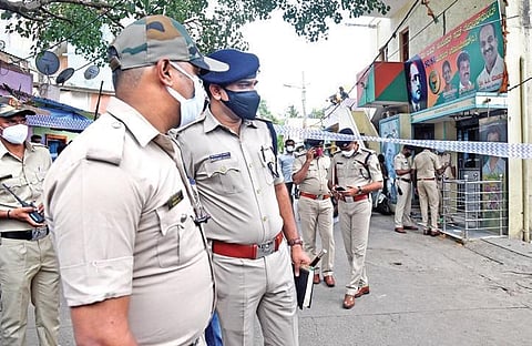 Police officers inspect the spot where former BBMP corporator Rekha Kadiresh (right) was murdered in Bengaluru on Thursday | Vinod Kumar T