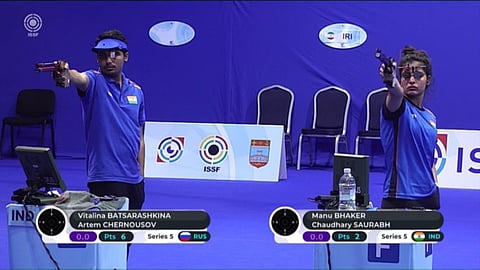 Indian duo of Saurabh Chaudhary and Manu(R) in the 10m air pistol mixed team event at the ISSF Shooting World Cup. (Photo | Twitter/@SAImedia)