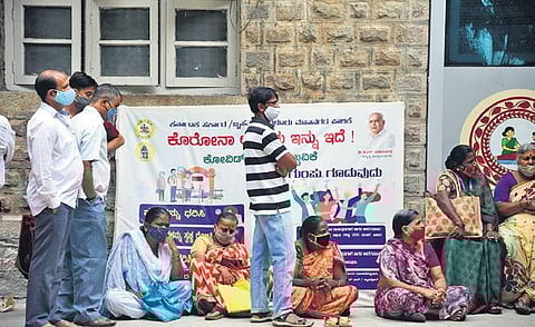 Citizens wait in a queue at Dasappa Maternity Hospital, where a vaccination drive for 18+ was conducted, in Bengaluru on Saturday | Ashishkrishna HP