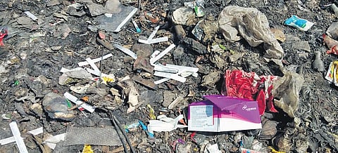 Biomedical waste dumped near Mudichur lake in the suburbs of Chennai. (Photo| EPS)