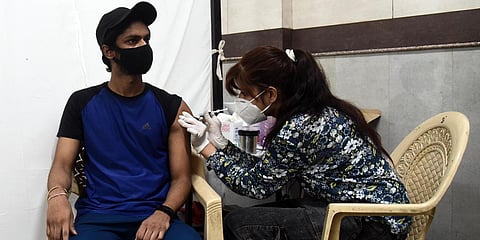 A beneficiary gets a jab of COVID-19 vaccine, at a government school in New Delhi. (Photo| Parveen Negi, EPS)