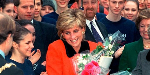 File photo of Diana, the Princess of Wales as she smiles after receiving bouquets of flowers from admirers. (Photo | AP)