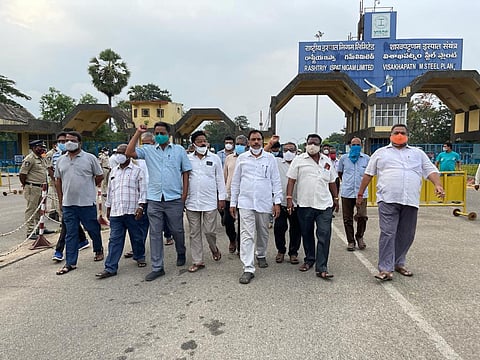Steel plant union leaders staging a dharna during the one-day strike at the gate of the plant in Visakhapatnam on Tuesday (Express Photo | GSN Venu)