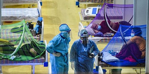 COVID-19 patients receive treatment inside CWG Covid Care Centre in New Delhi. (Photo | PTI)