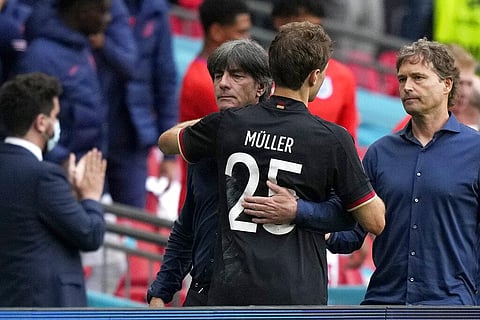 Germany's manager Joachim Loew embraces Germany's Thomas Mueller at the end of the Euro 2020 soccer championship round of 16 match between England and Germany. (Photo | AP)