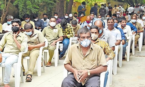 Auto drivers wait for their vaccine shots at a special drive organised by the Telangana Transport Department in Hyderabad on Thursday | RVK RAO