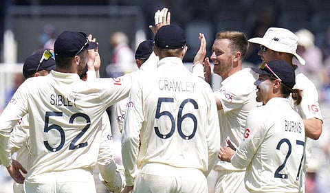 England's Ollie Robinson celebrates taking the wicket of New Zealand's Colin de Grandhomme during the second day of the Test match between England and New Zealand at Lord's. (Photo | AP)