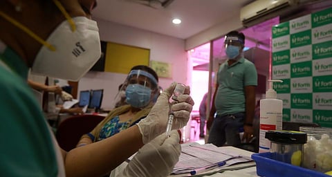 A beneficiary receives a dose of the COVID-19 vaccine. (Photo | Shekhar Yadav, EPS)