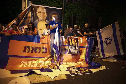 Israeli protesters chant slogans and hold flags during a demonstration against the forming of a new government in the central Israeli city of Ramat Gan, Wednesday, June 2. (Photo | AP)